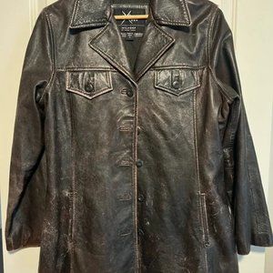1999 Maxima leather jacket from Wilson’s distressed with small tears in pockets